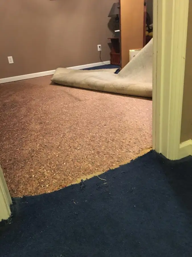 Carpet pad removal revealing water damage during Water Mitigation Services in Coeur d'Alene